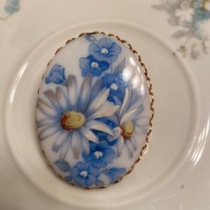 Vintage floral ceramic brooch in gold metal setting hand painting 1 3/4 x 1 1/4”